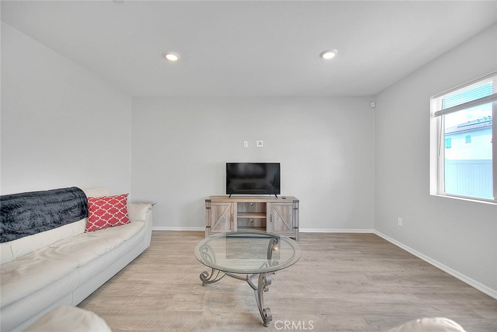 885 Canopy Lane San Jacinto, CA 92583 - Photo 42 of 75 a living room with furniture and a flat screen tv