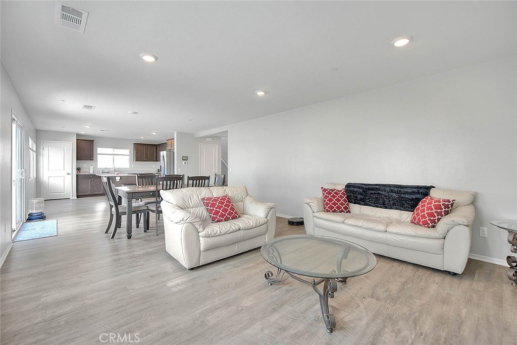 885 Canopy Lane San Jacinto, CA 92583 - Photo 43 of 75 a living room with furniture and kitchen view