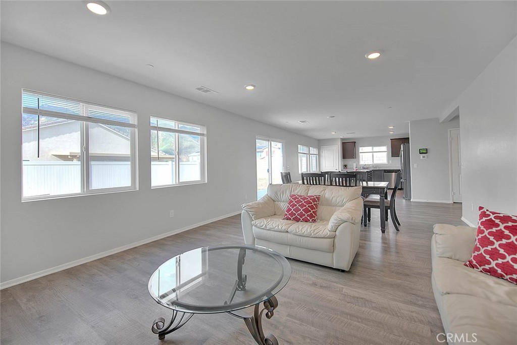 885 Canopy Lane San Jacinto, CA 92583 - Photo 44 of 75 a living room with furniture and a chandelier