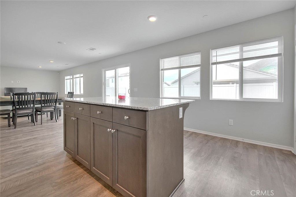 885 Canopy Lane San Jacinto, CA 92583 - Photo 54 of 75 a room with lots of wooden furniture wooden floor and a window