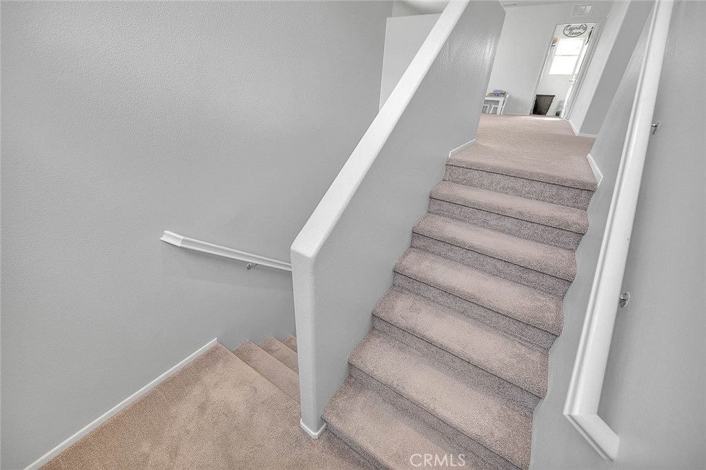 885 Canopy Lane San Jacinto, CA 92583 - Photo 56 of 75 a view of staircase with white walls and white walls