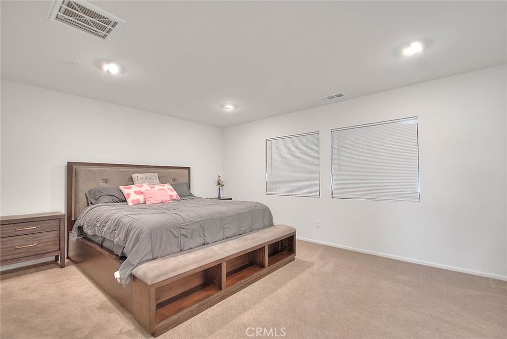 885 Canopy Lane San Jacinto, CA 92583 - Photo 72 of 75 a bedroom with a bed and a painting on the wall
