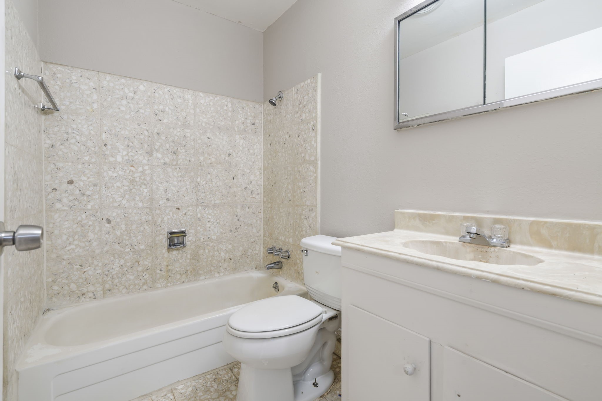 11607 Chimney Rock Road, Unit C Houston, TX 77035 - Photo 15 of 18 a bathroom with a sink a toilet and a bathtub