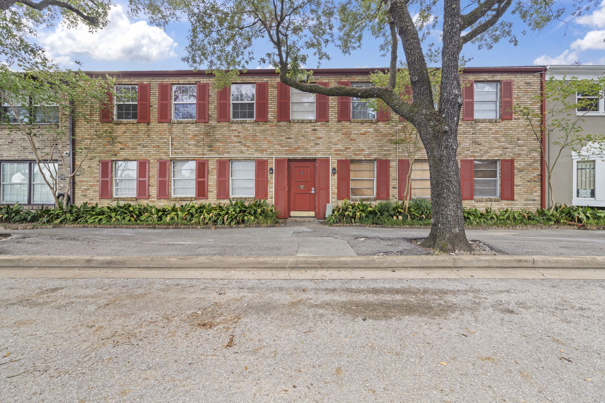 11607 Chimney Rock Road, Unit C Houston, TX 77035 - Photo 2 of 18 a front view of house with a yard
