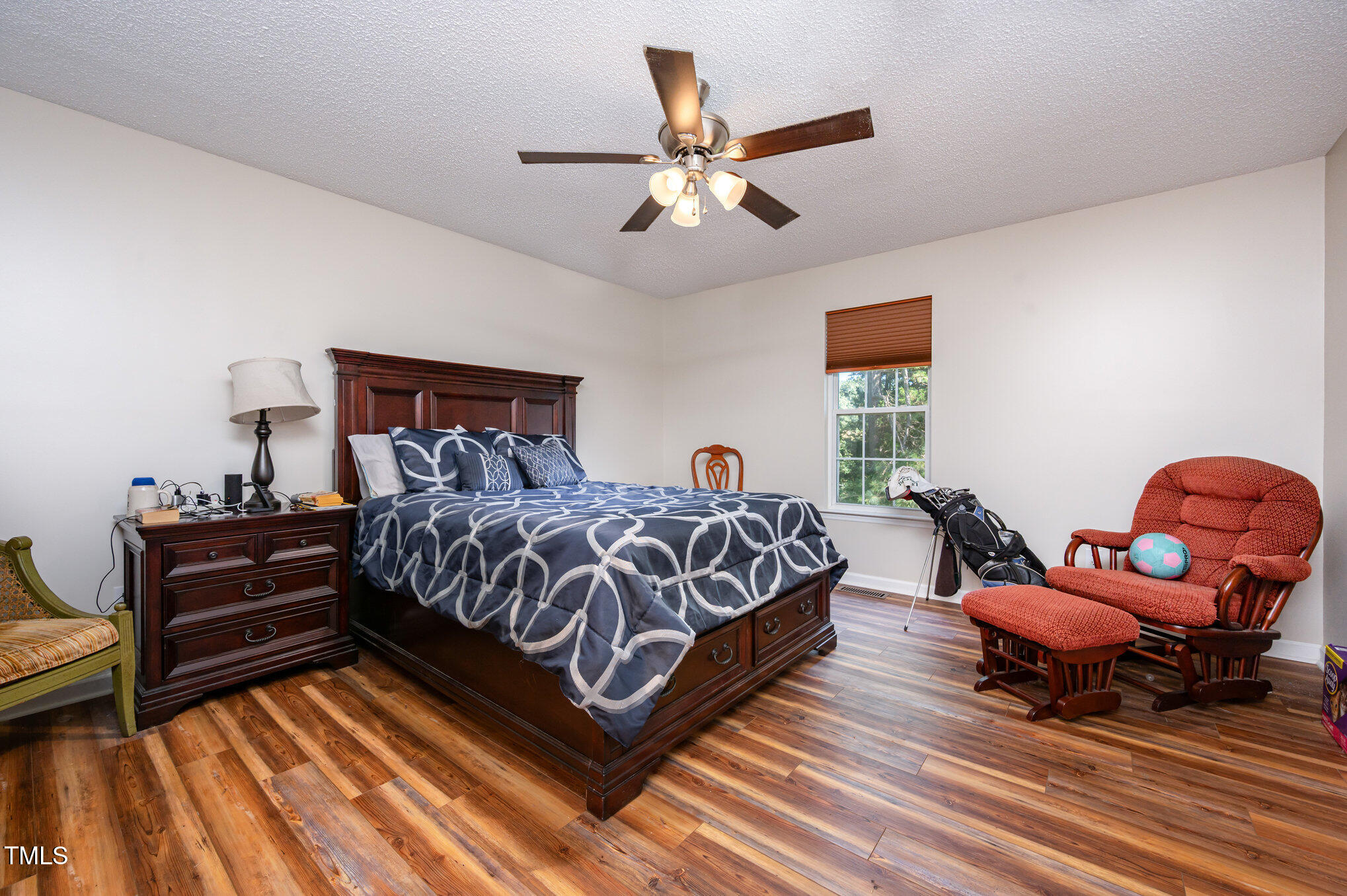 475 Jim Moore Road Timberlake, NC 27583 - Photo 10 of 26 a spacious bedroom with a bed and window