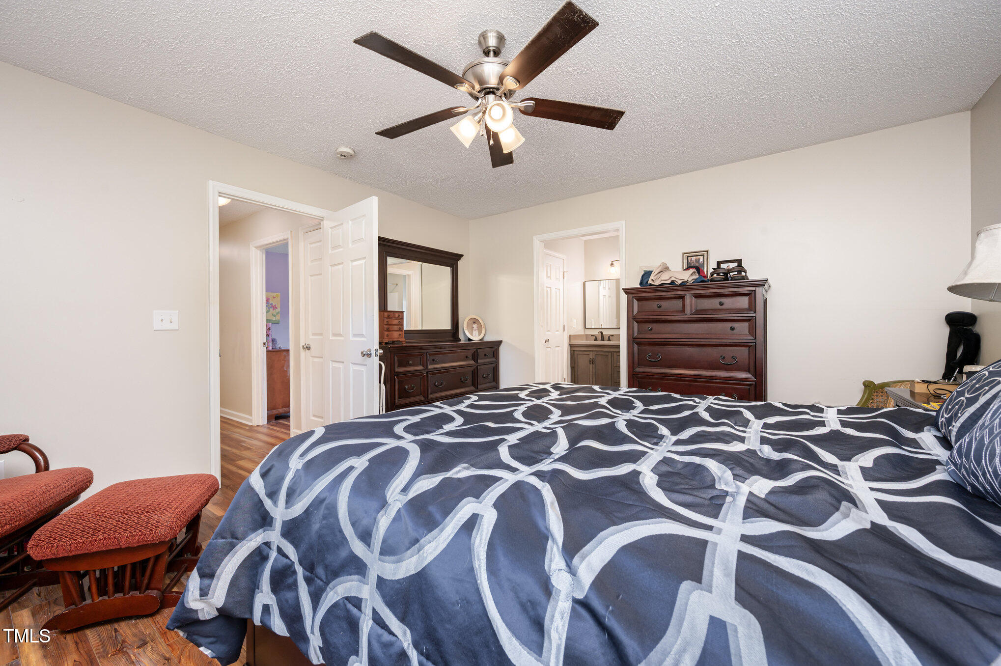 475 Jim Moore Road Timberlake, NC 27583 - Photo 11 of 26 a bedroom with a bed and dresser