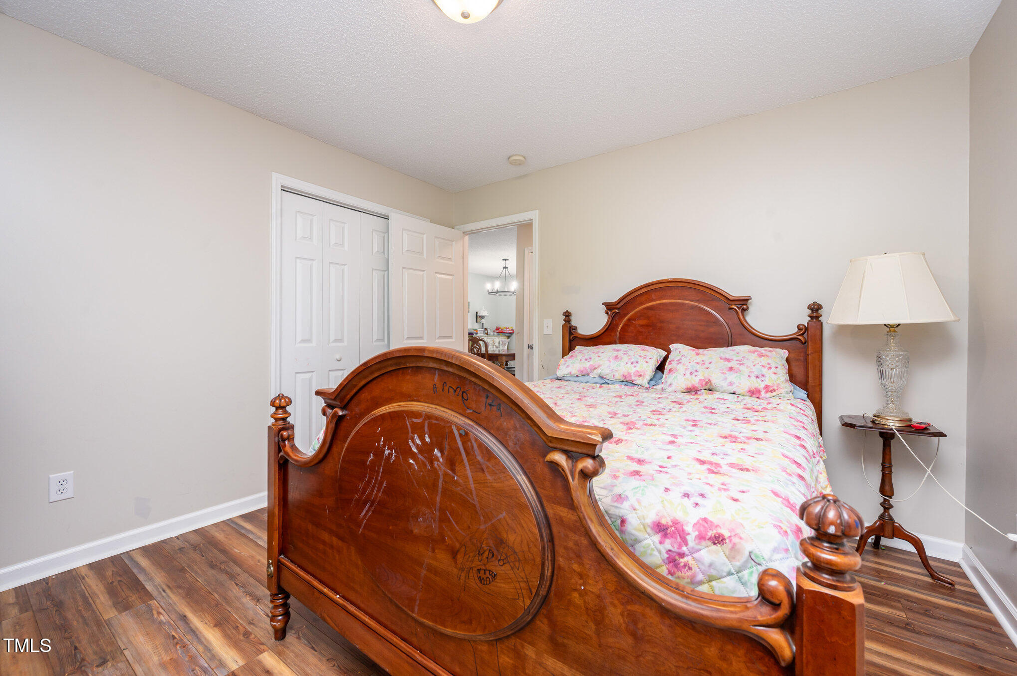 475 Jim Moore Road Timberlake, NC 27583 - Photo 14 of 26 a bedroom with a bed and a mirror