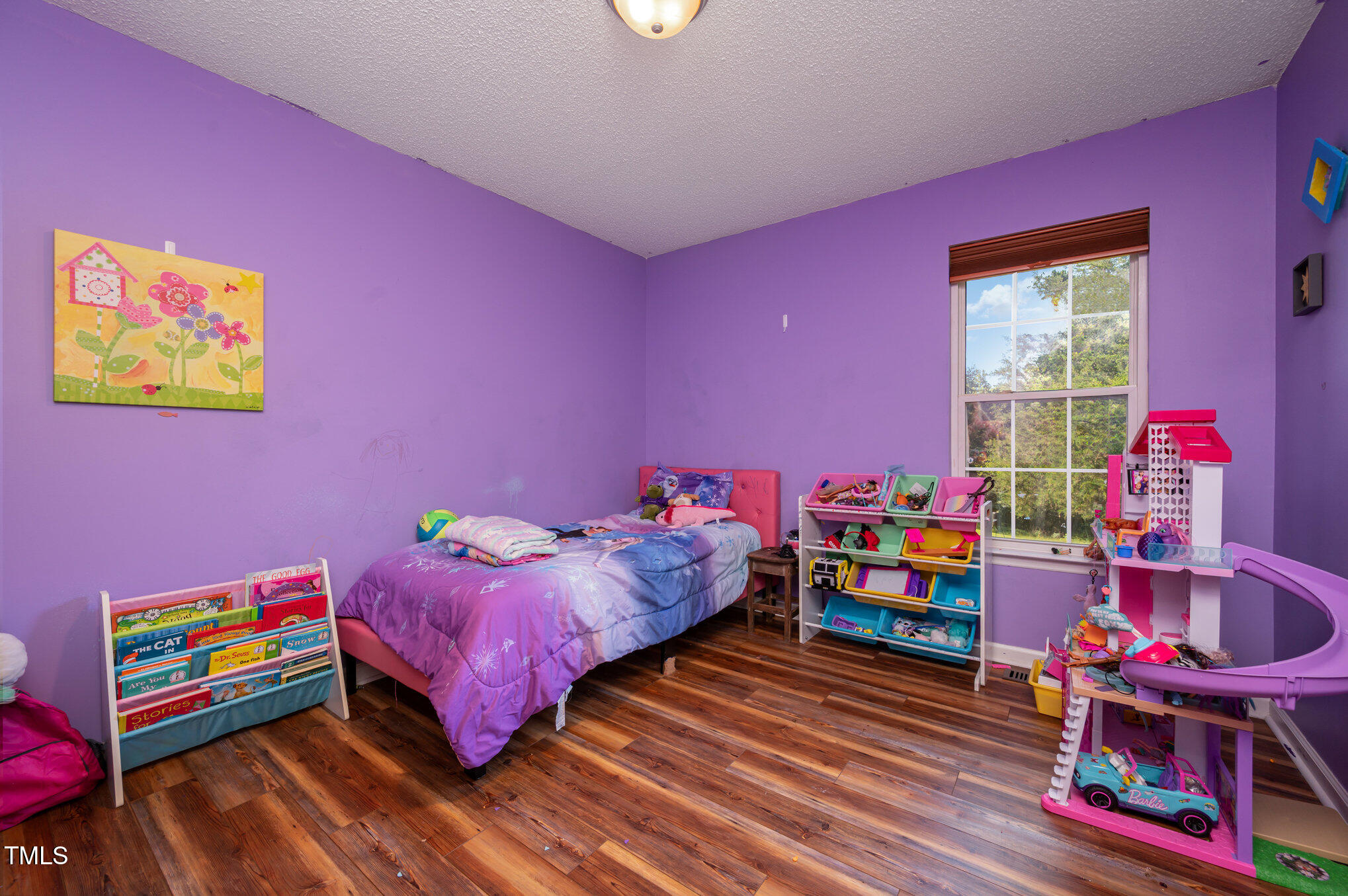 475 Jim Moore Road Timberlake, NC 27583 - Photo 16 of 26 a bedroom with furniture and a wooden floor