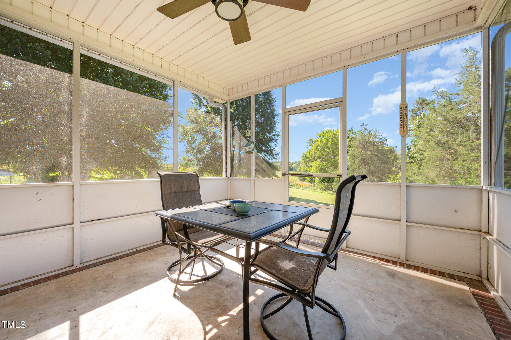 475 Jim Moore Road Timberlake, NC 27583 - Photo 17 of 26 a view of a dining room with furniture window and outside view