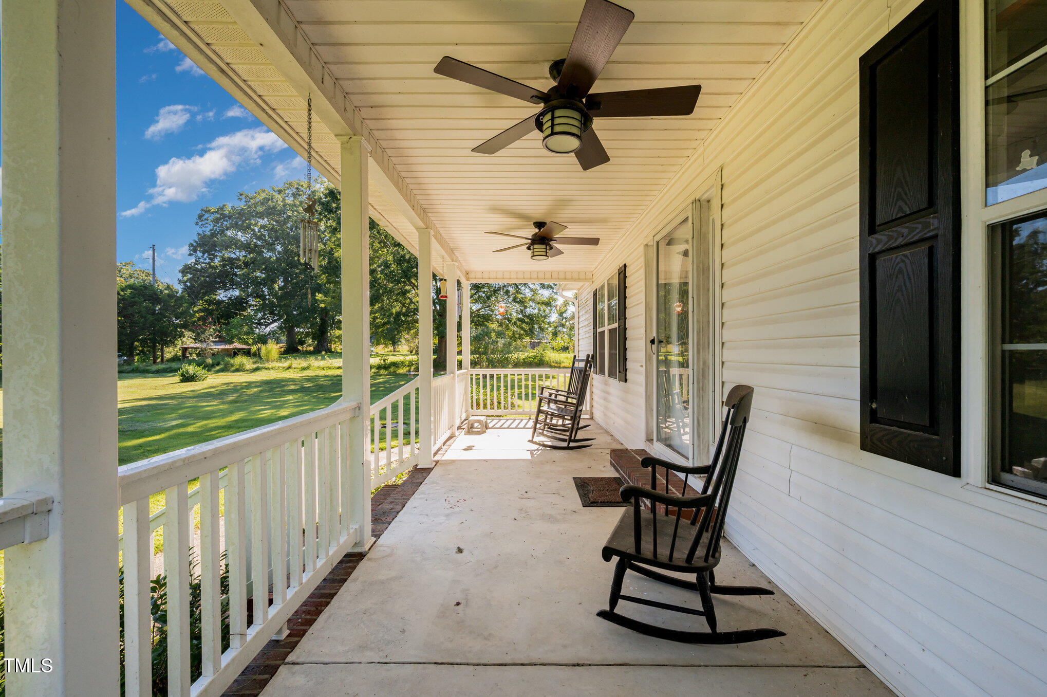 475 Jim Moore Road Timberlake, NC 27583 - Photo 20 of 26 a view of a chair and table in the balcony