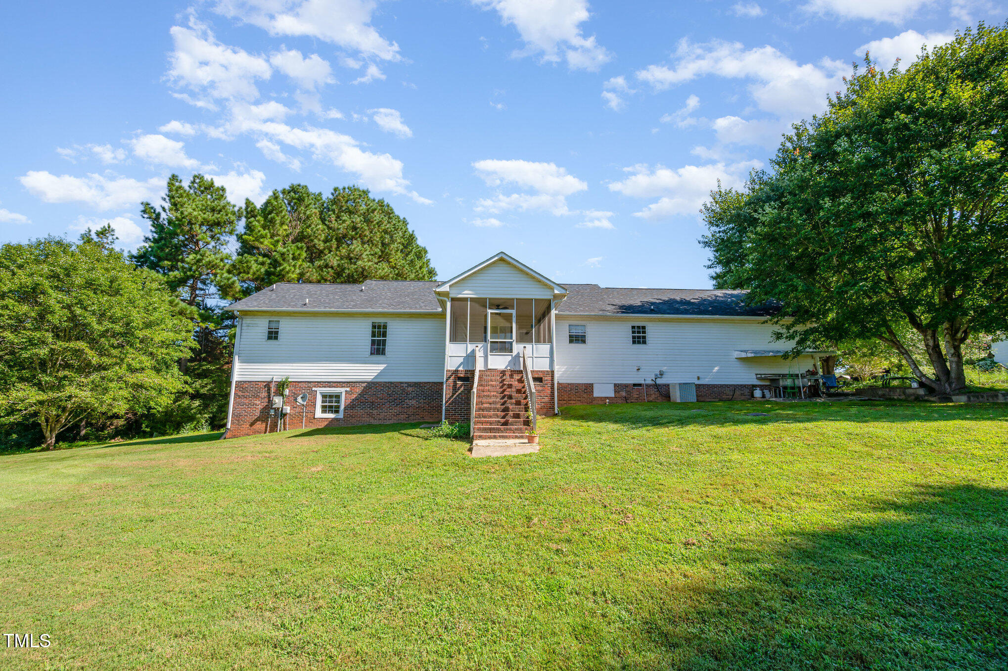 475 Jim Moore Road Timberlake, NC 27583 - Photo 22 of 26 a view of a house with backyard and a tree