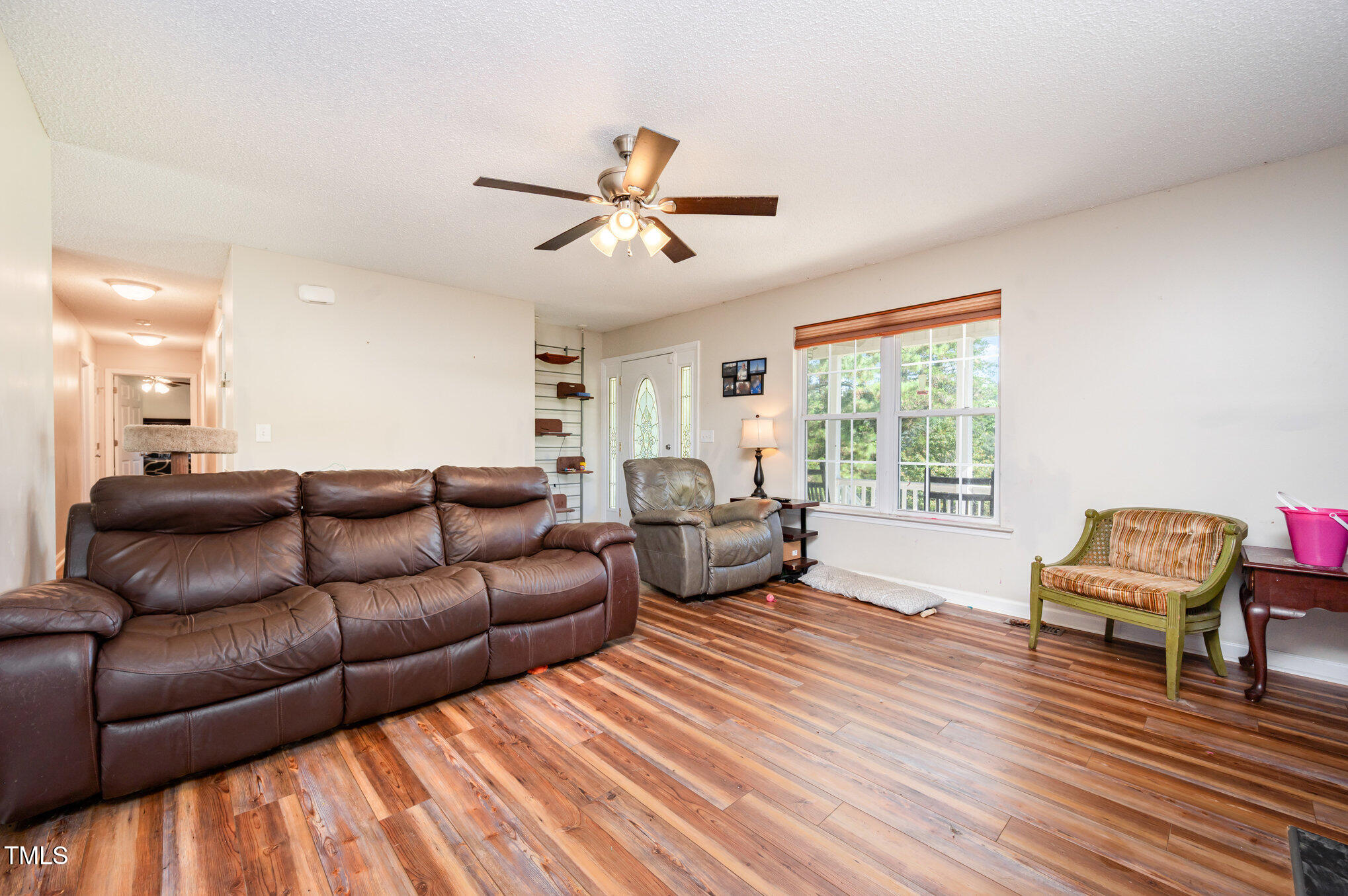 475 Jim Moore Road Timberlake, NC 27583 - Photo 9 of 26 a living room with furniture and a large window