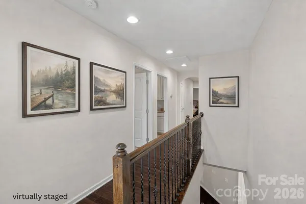 a view of a hallway with staircase