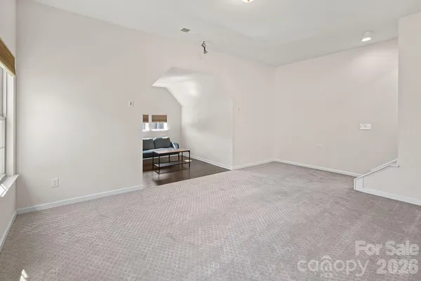 a view of an empty room with a fireplace