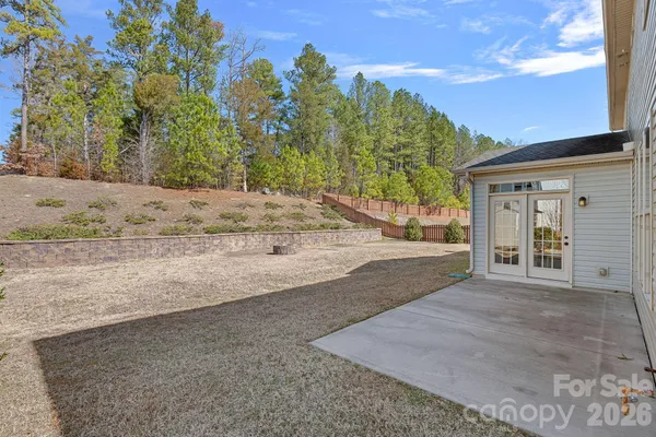 a view of a house with a yard and garage