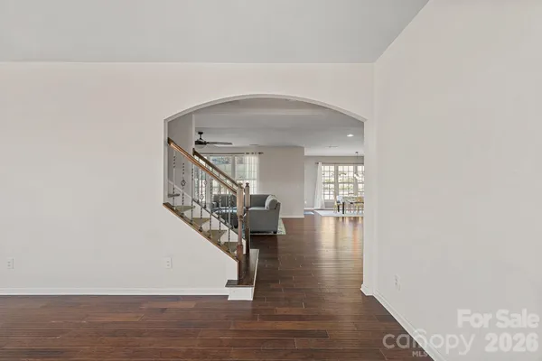 a view of entryway and hall with wooden floor