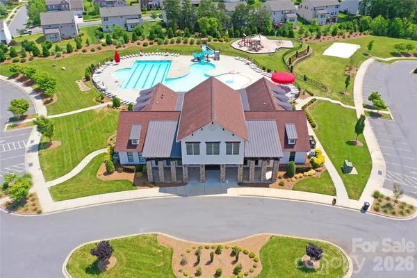 an aerial view of a house with a swimming pool