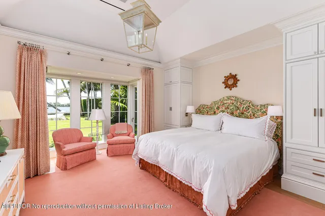 a spacious bedroom with a bed and a couch