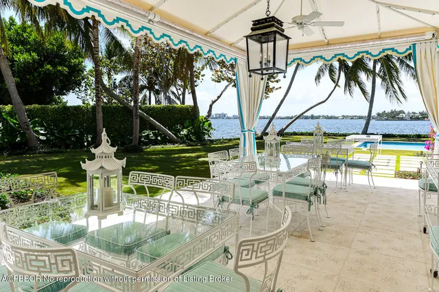 a view of swimming pool with outdoor seating and a patio