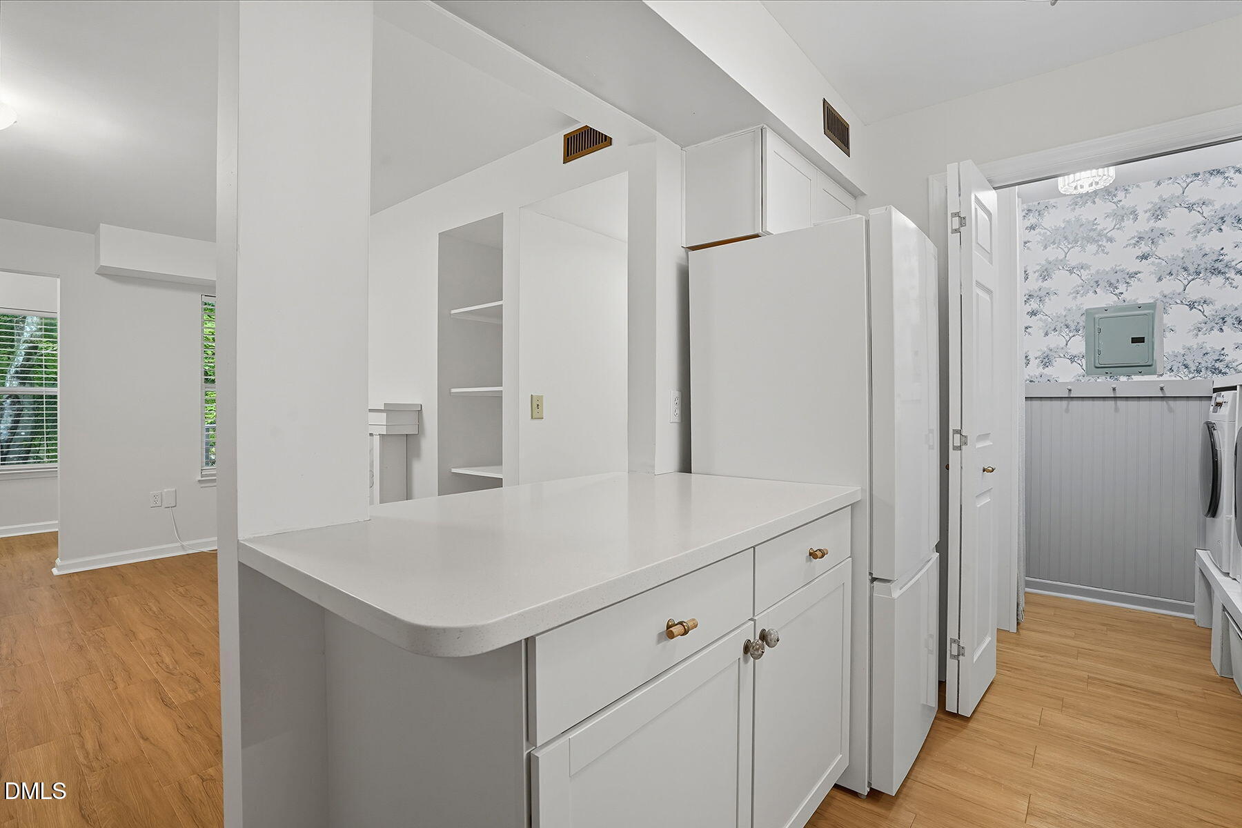 1308 Hillbrow Lane, Unit 203 Raleigh, NC 27615 - Photo 13 of 27 a view of cabinets with wooden floor and cabinet