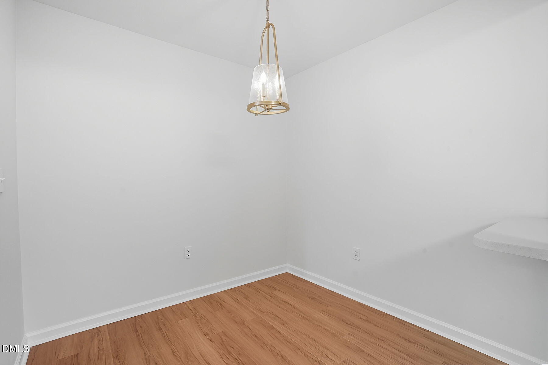 1308 Hillbrow Lane, Unit 203 Raleigh, NC 27615 - Photo 15 of 27 a view of a room with wooden floor and window