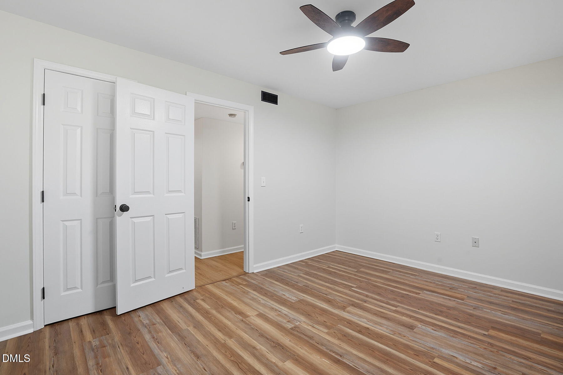 1308 Hillbrow Lane, Unit 203 Raleigh, NC 27615 - Photo 19 of 27 a view of empty room with wooden floor