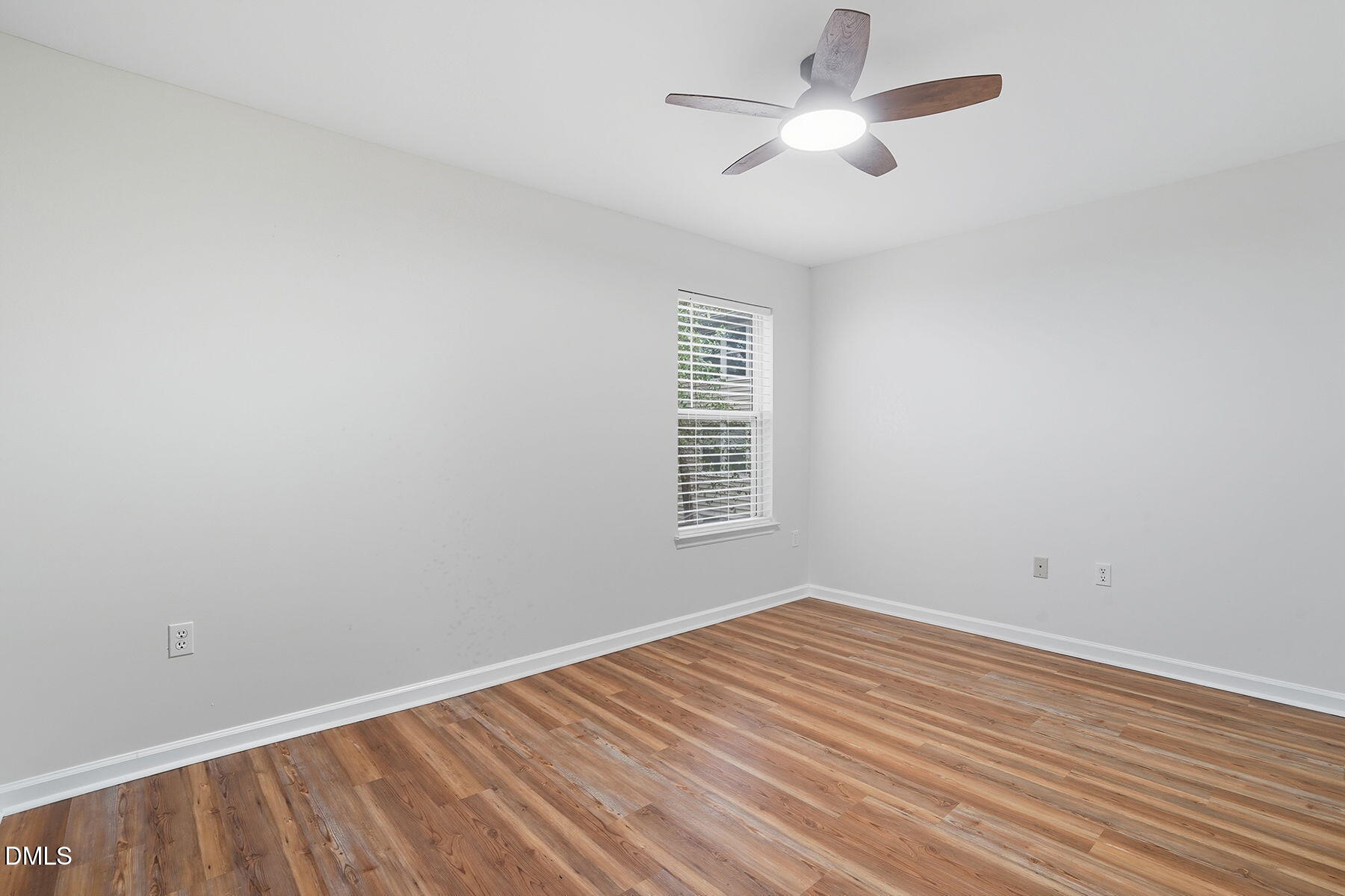 1308 Hillbrow Lane, Unit 203 Raleigh, NC 27615 - Photo 20 of 27 an empty room with a window and a ceiling fan
