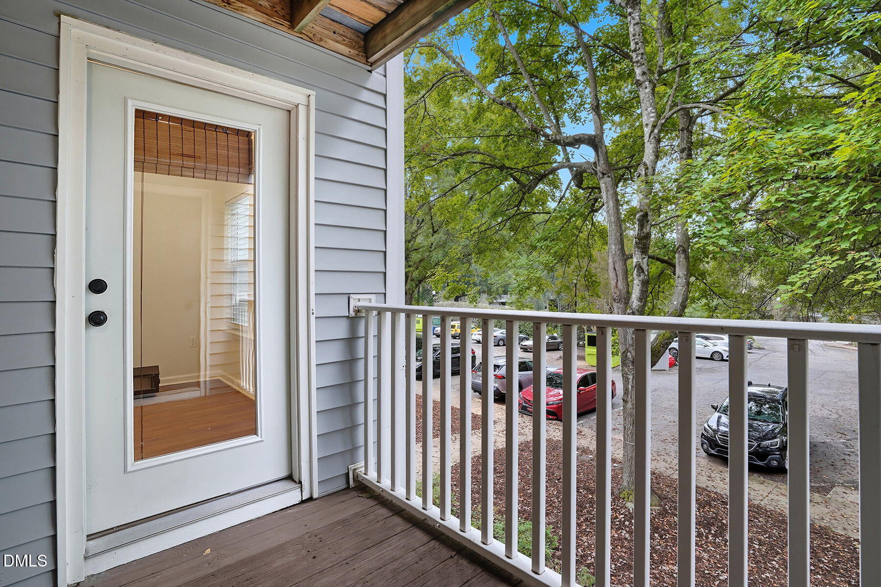 1308 Hillbrow Lane, Unit 203 Raleigh, NC 27615 - Photo 23 of 27 a view of a balcony with wooden floor