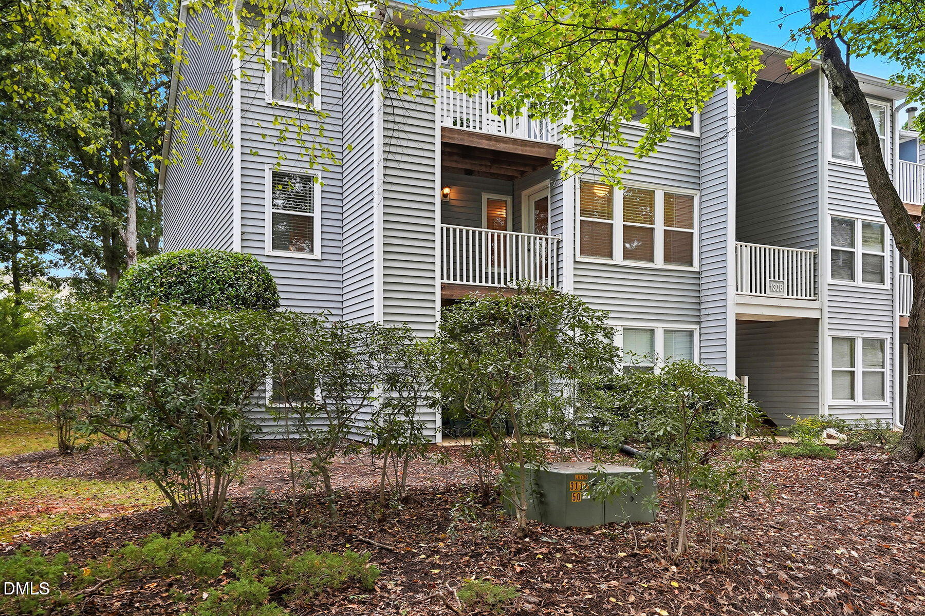 1308 Hillbrow Lane, Unit 203 Raleigh, NC 27615 - Photo 27 of 27 a view of a house with backyard and sitting area