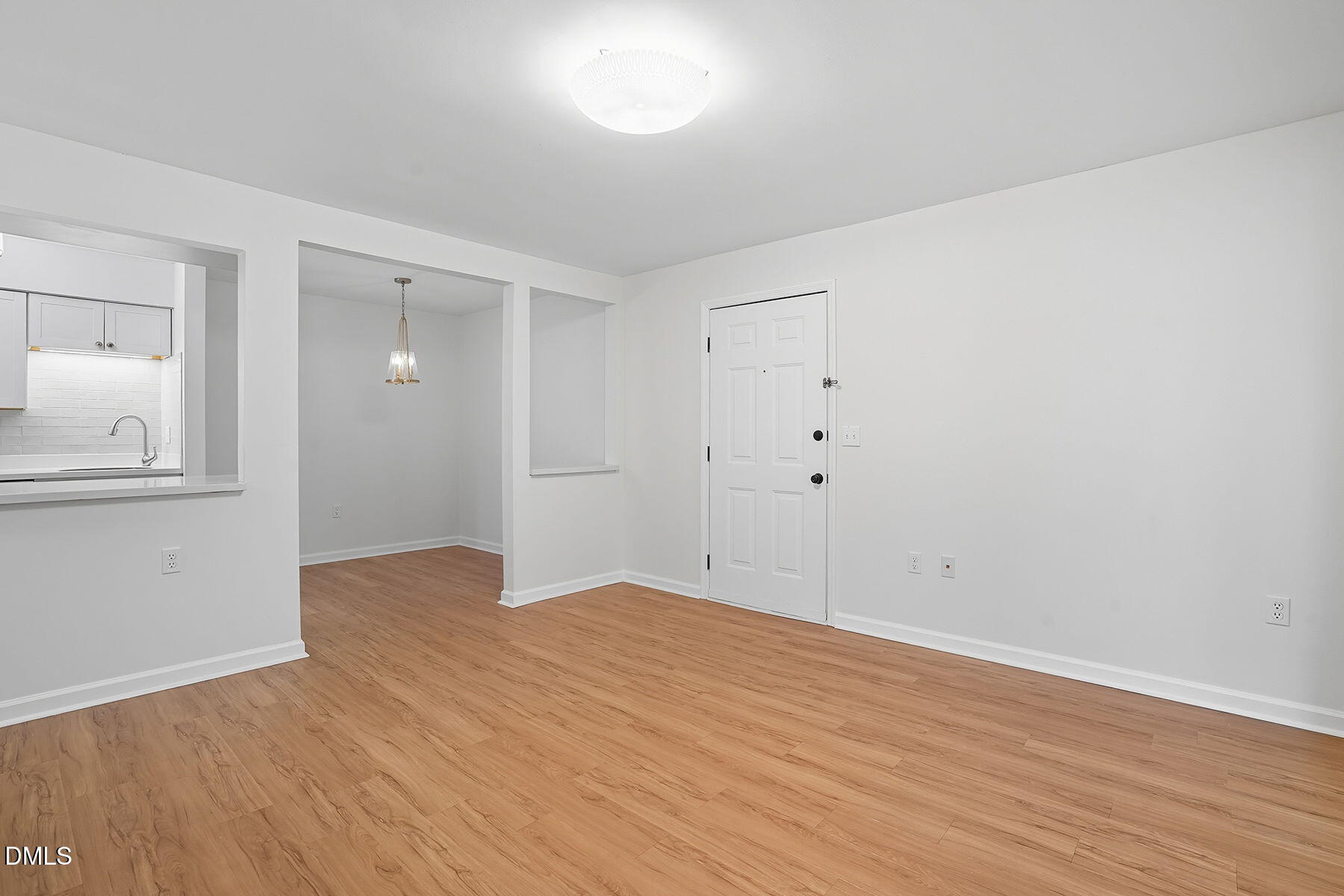 1308 Hillbrow Lane, Unit 203 Raleigh, NC 27615 - Photo 9 of 27 wooden floor in an empty room