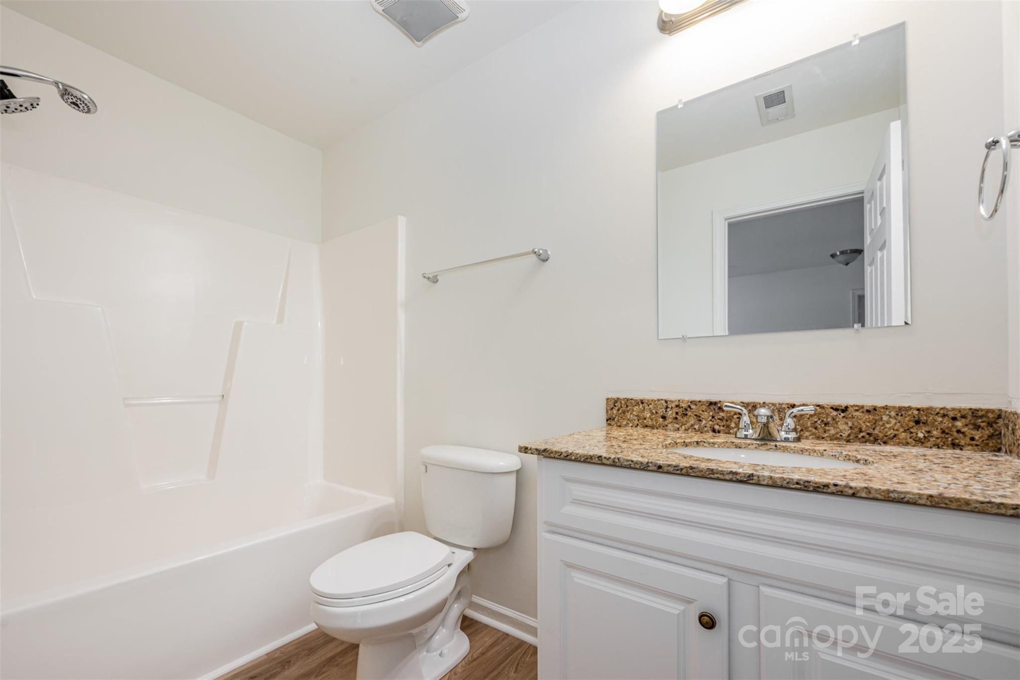 2206 Kingstree Drive Monroe, NC 28112 - Photo 15 of 25 a bathroom with a toilet sink and mirror