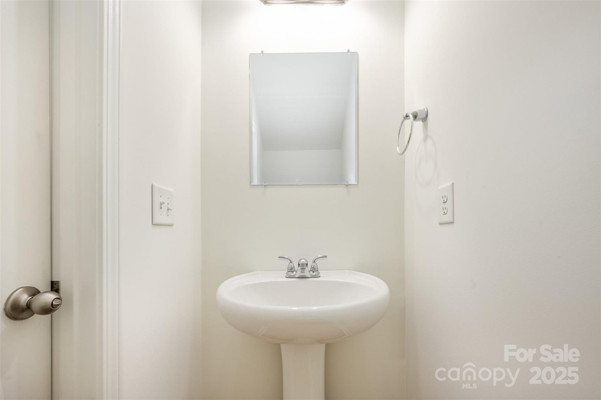 2206 Kingstree Drive Monroe, NC 28112 - Photo 8 of 25 a bathroom with a sink and mirror