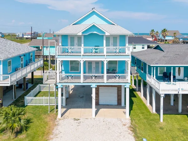 a aerial view of a house with a yard