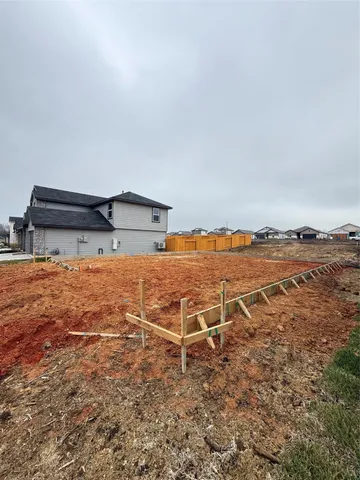 an ocean view with wooden fence