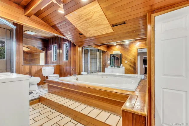 a room with pool table and windows