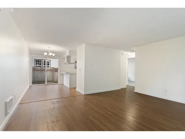 a view of a kitchen with a sink dishwasher a stove refrigerator and cabinets
