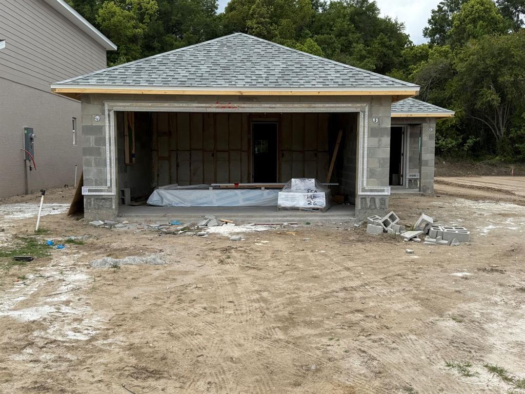 2226 Northwest 23rd Loop Ocala, FL 34475 - Photo 2 of 10 a front view of a house with garden