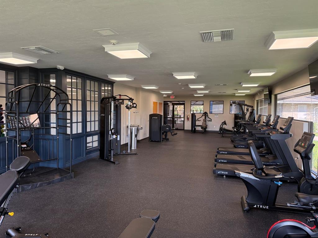 2226 Northwest 23rd Loop Ocala, FL 34475 - Photo 4 of 10 a view of a room with gym equipment
