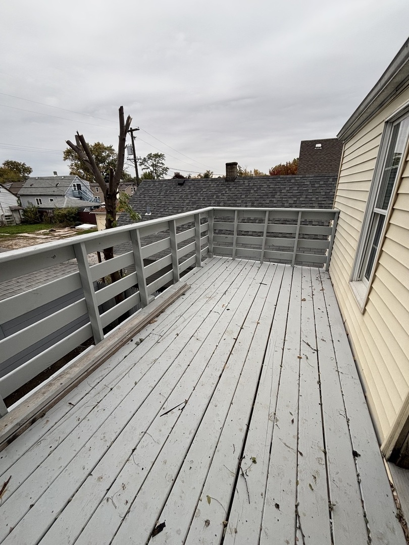 15634 Union Avenue Harvey, IL 60426 - Photo 11 of 34 a view of deck with wooden floor and outdoor seating