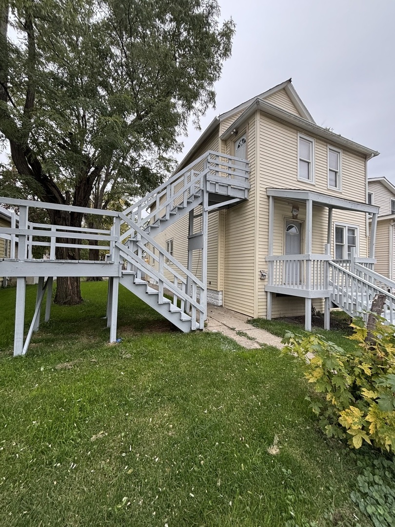 15634 Union Avenue Harvey, IL 60426 - Photo 2 of 34 a view of a house with a yard