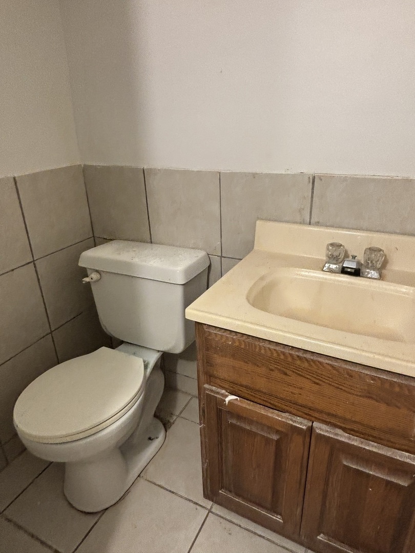 15634 Union Avenue Harvey, IL 60426 - Photo 29 of 34 a bathroom with a toilet and a sink