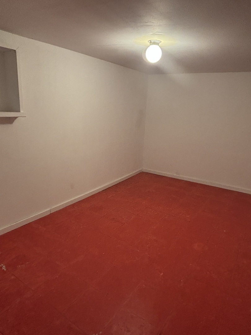 15634 Union Avenue Harvey, IL 60426 - Photo 30 of 34 an empty room with fan and mirror