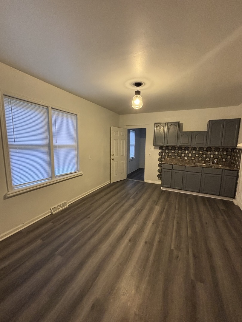 15634 Union Avenue Harvey, IL 60426 - Photo 3 of 34 a view of a room with a wooden door