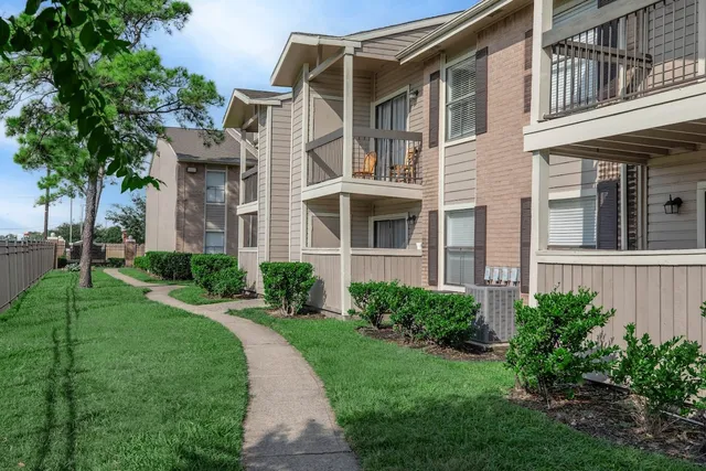 a view of a building with a yard