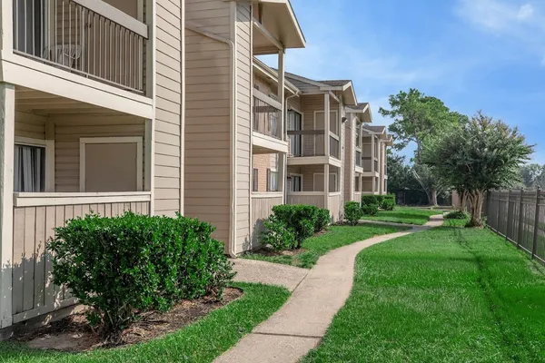 a view of a building with a yard