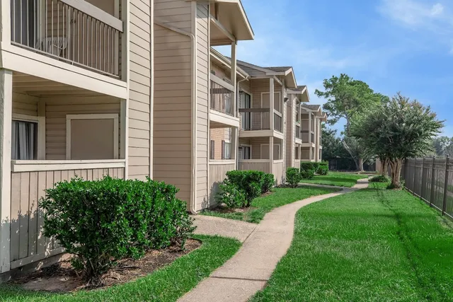 a view of a building with a yard