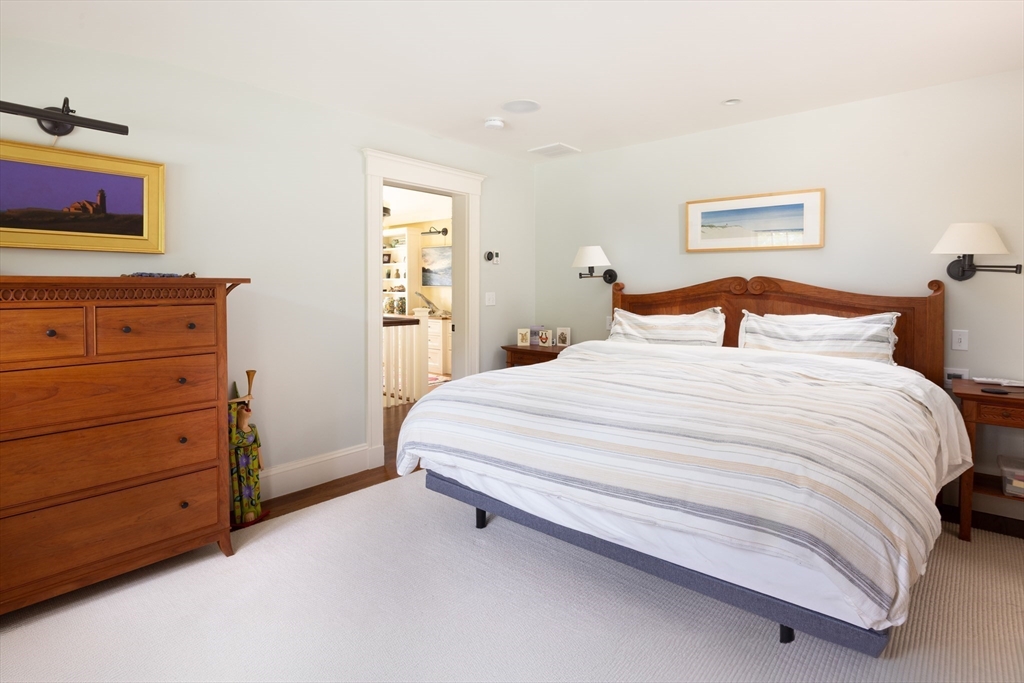 87 Greenough Street, Unit 2 Brookline, MA 02445 - Photo 14 of 23 a bedroom with a bed and a dresser