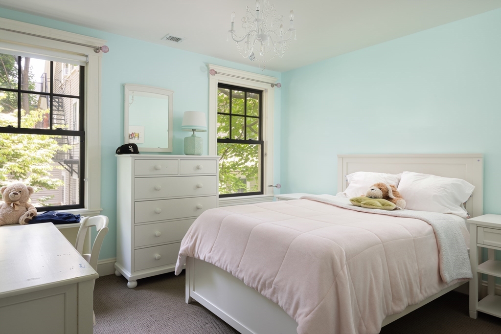 87 Greenough Street, Unit 2 Brookline, MA 02445 - Photo 15 of 23 a bedroom with a bed and a window