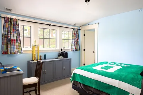 a room with a bed and a window