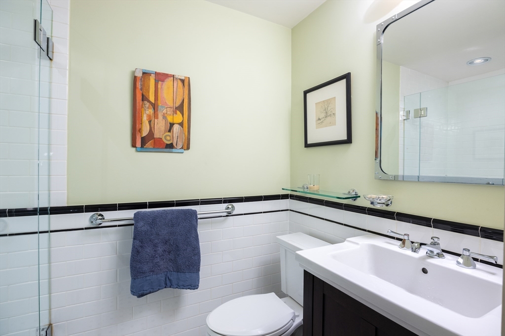 87 Greenough Street, Unit 2 Brookline, MA 02445 - Photo 20 of 23 a bathroom with a sink and a mirror